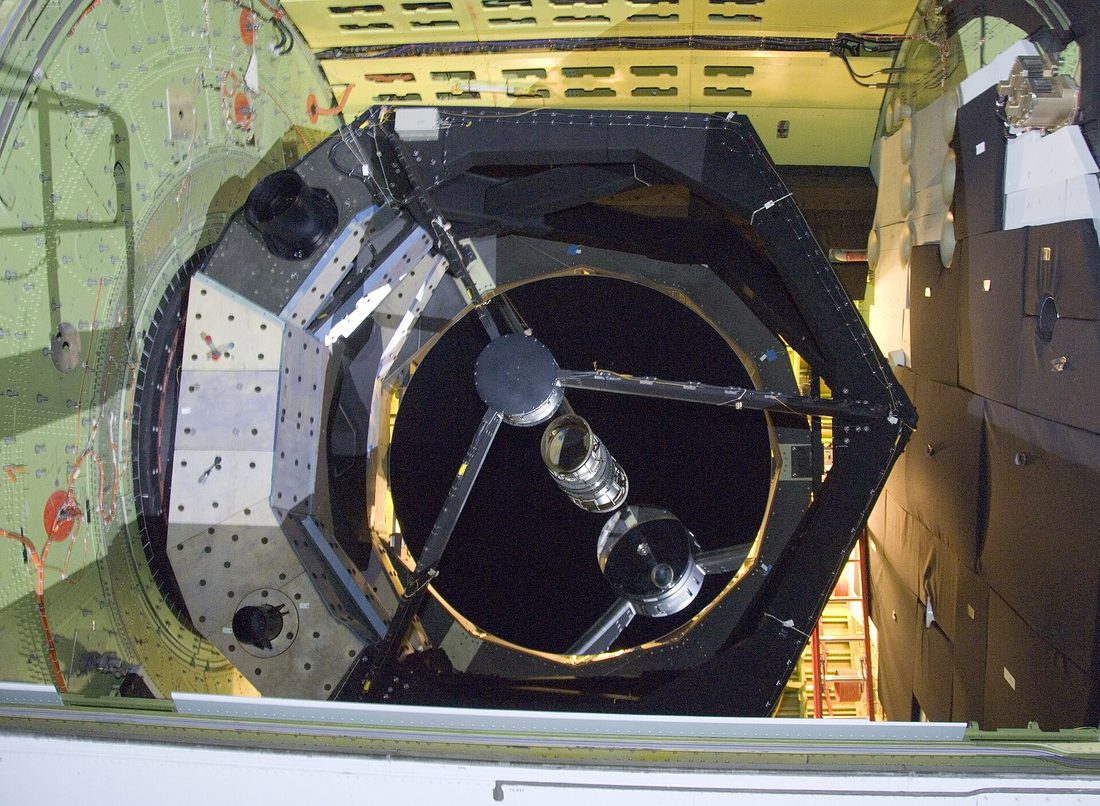 The SOFIA airborne observatory's 2.5-metre telescope looking out of the Boeing 747SP.